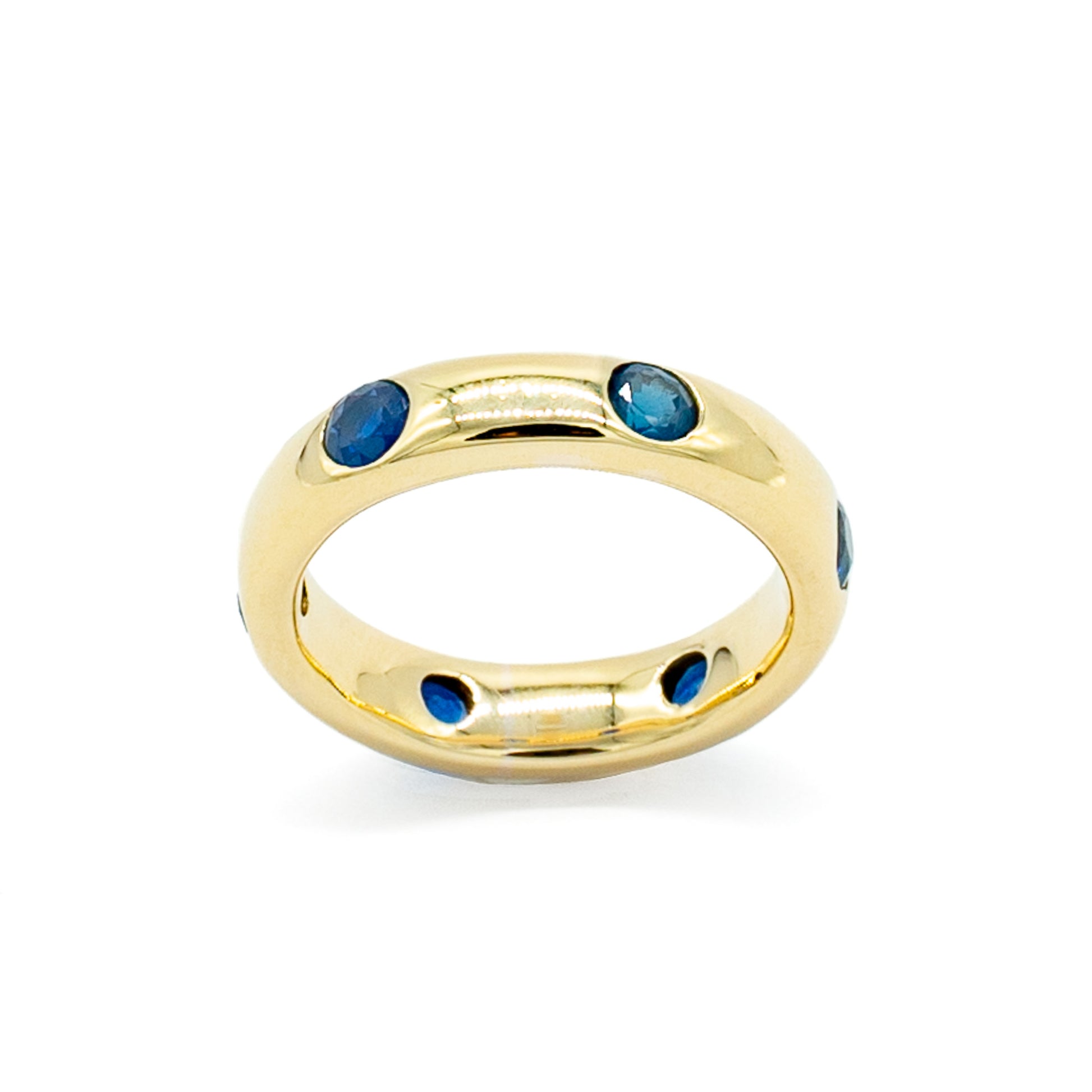 Stunning 12ct gold eternity ring set with six beautiful blue faceted sapphires.