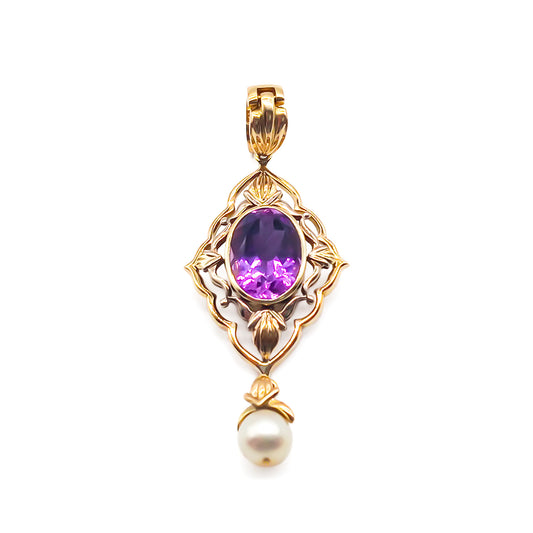 Stunning 14ct gold pendant set with a beautifully faceted oval amethyst and cultured pearl drop. Bale opens - allowing pendant to be added to pearls.