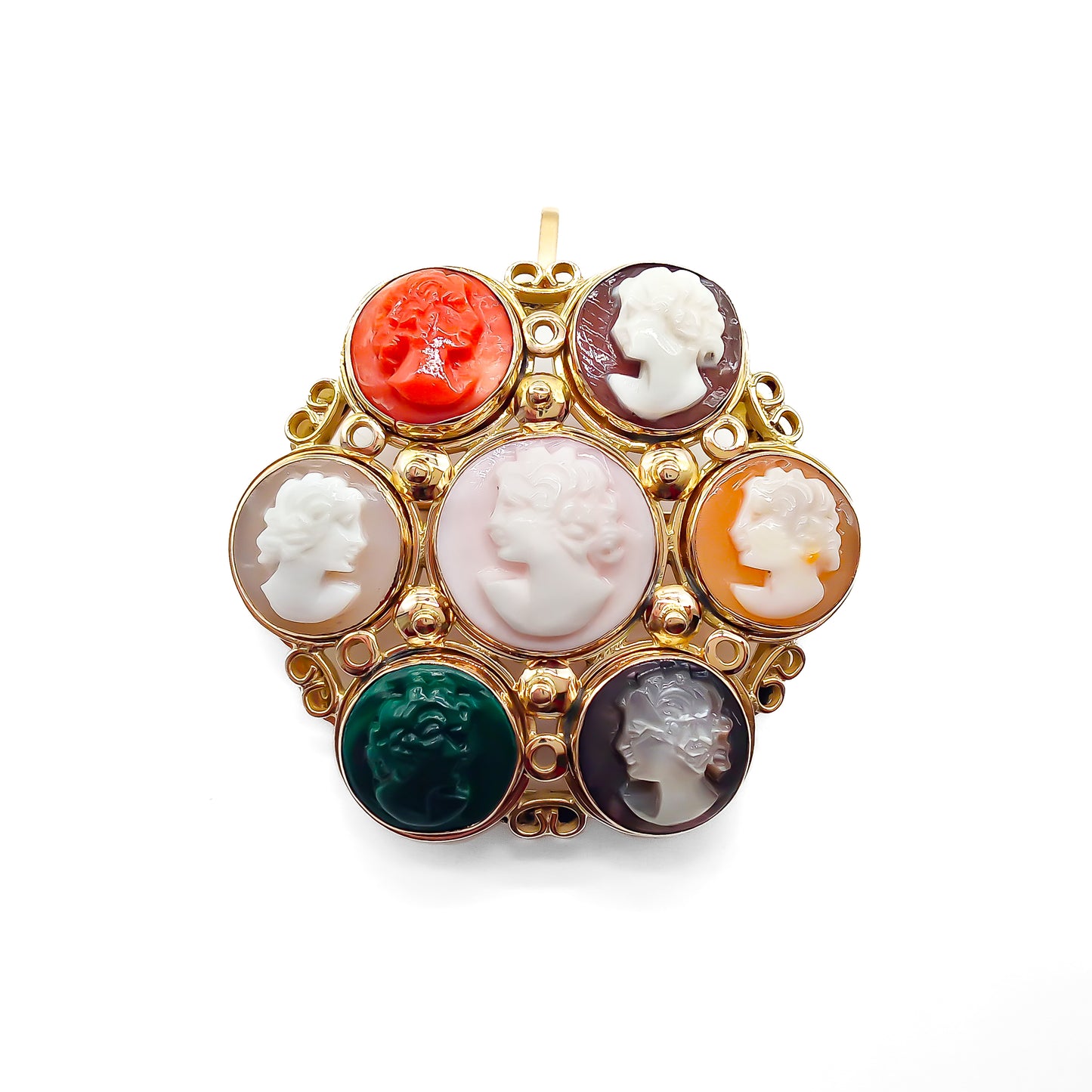 Unique 14ct yellow gold pendant/brooch set with a variety of seven small cameos, including one coral and one chrysoprase. Beautiful scroll work on setting.