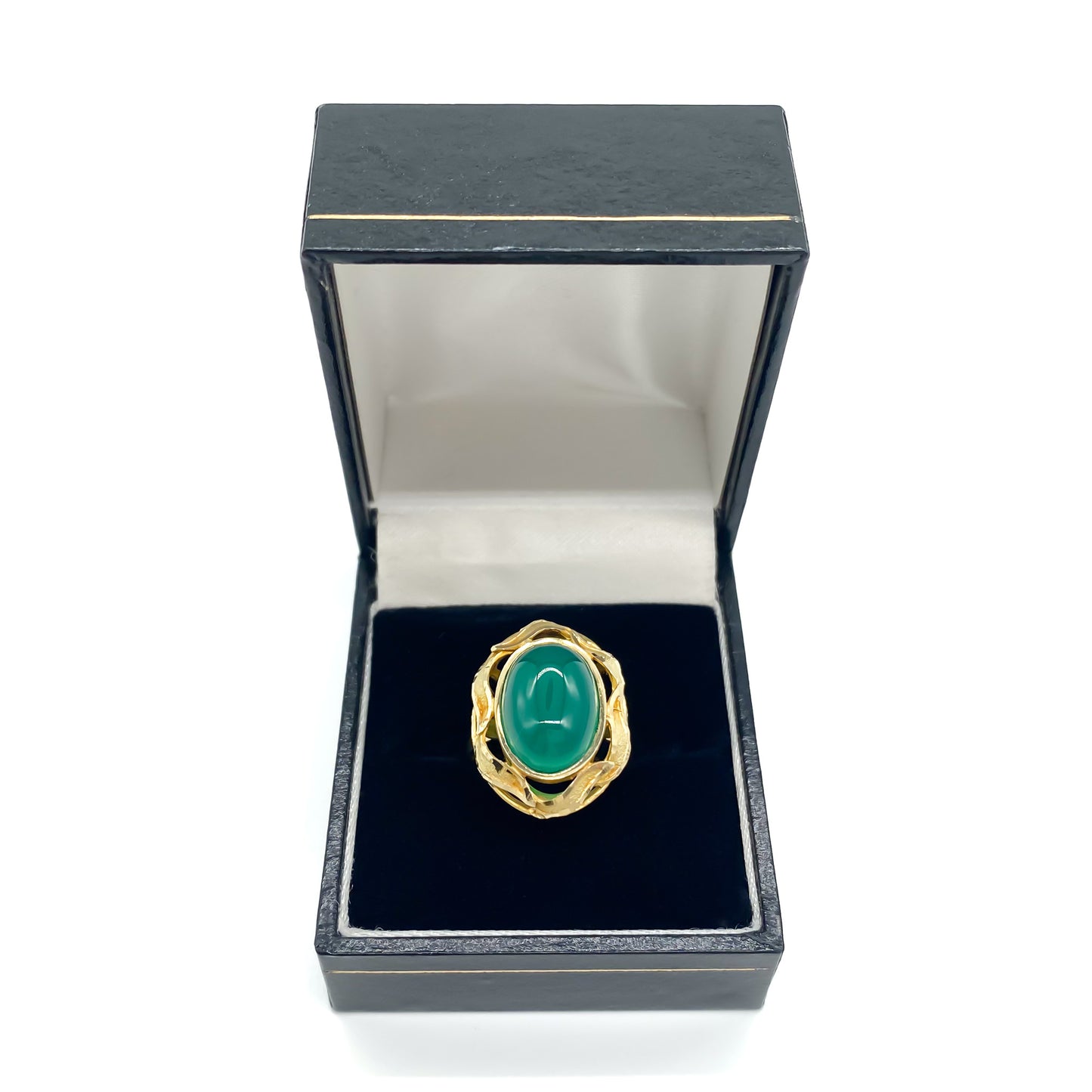 Stunning 14ct yellow gold ring set with a bright green oval chrysoprase cabochon, surrounded by a textured gold border.