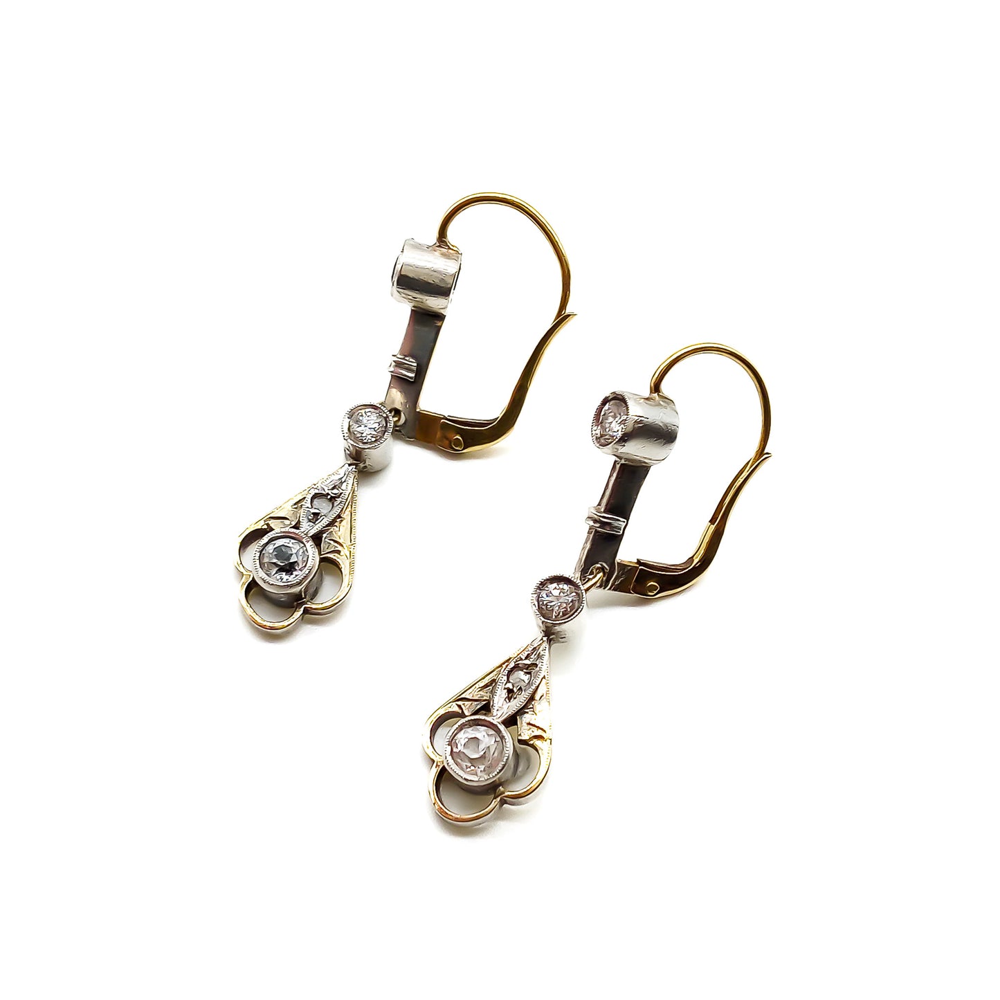 Elegant 14ct white and yellow gold drop earrings, each set with four old-cut diamonds. Circa 1900’s