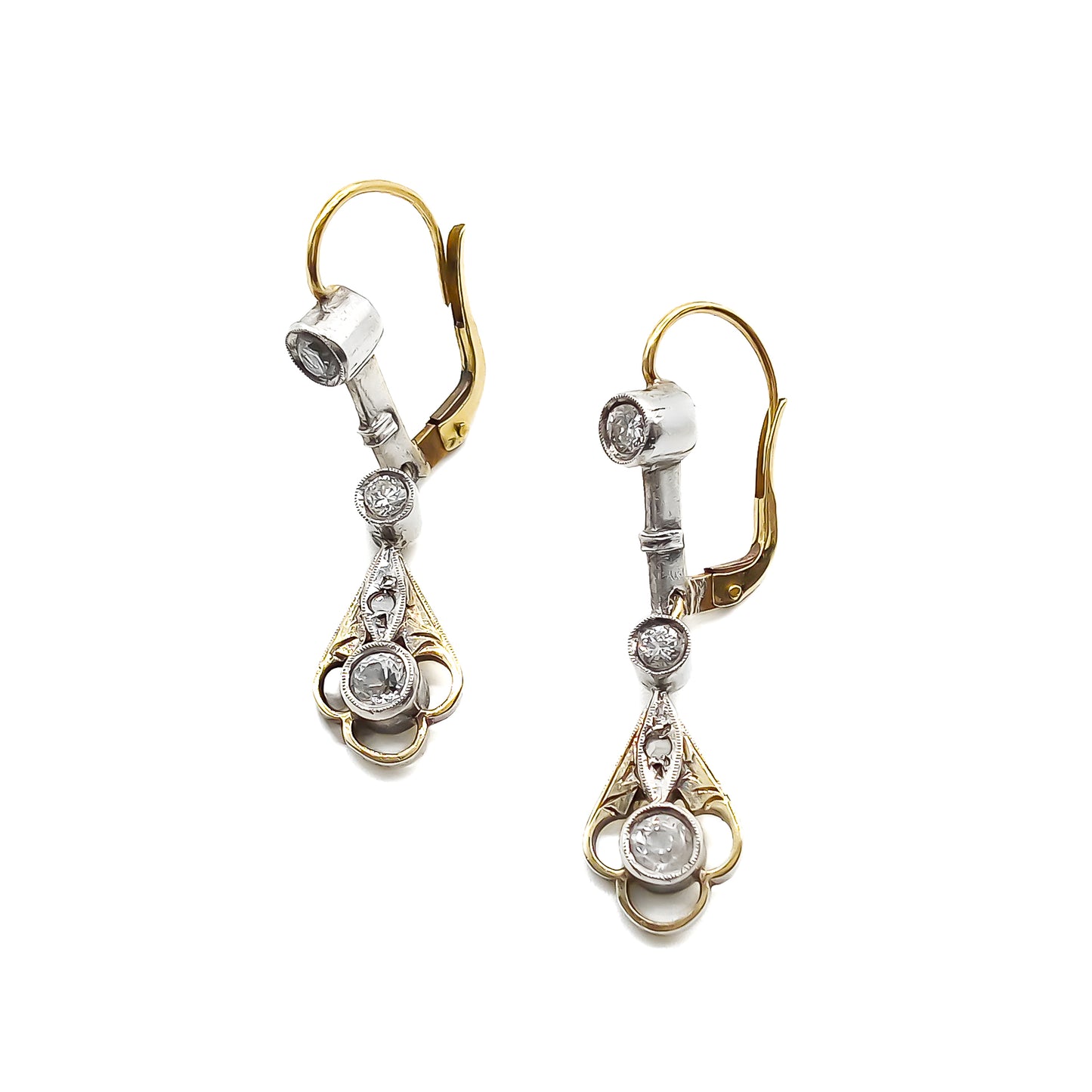 Elegant 14ct white and yellow gold drop earrings, each set with four old-cut diamonds. Circa 1900’s