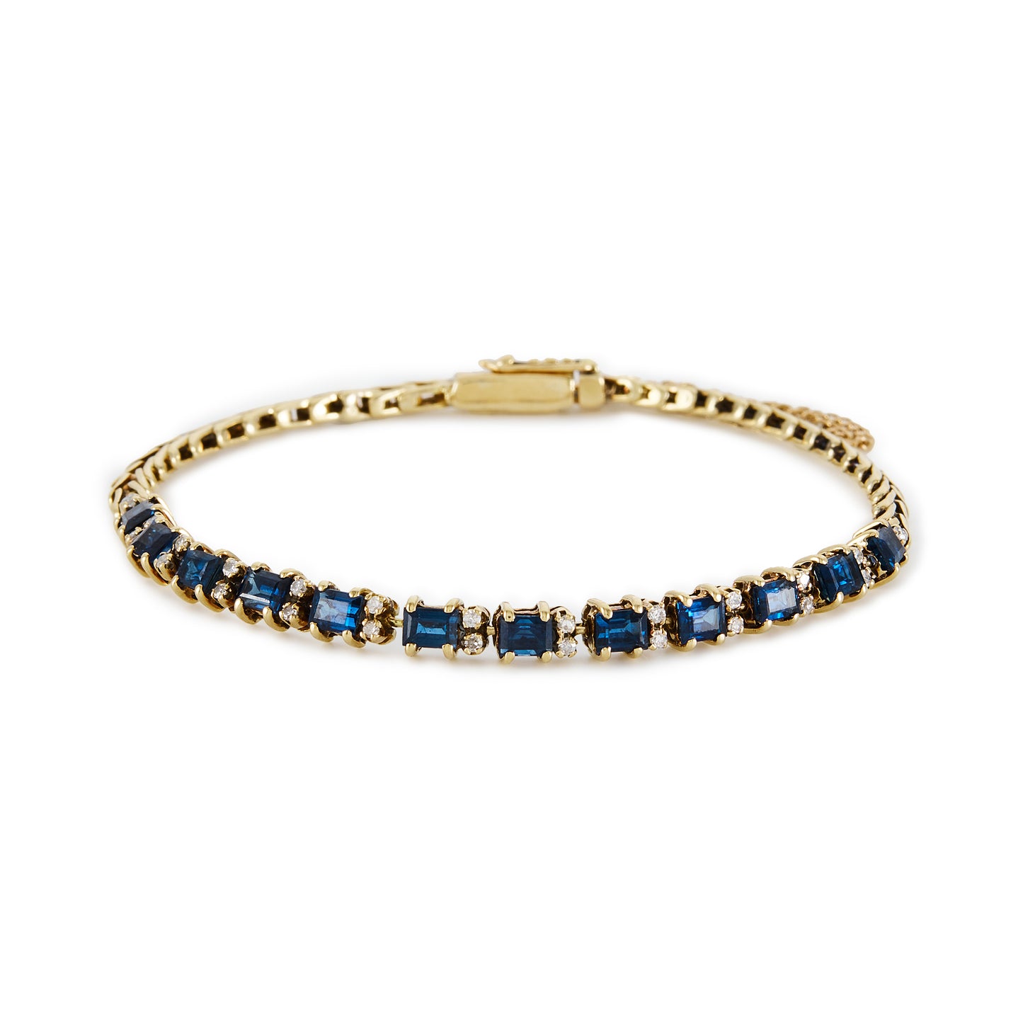 Classic 14ct gold tennis bracelet, set with twelve deep blue rectangular sapphires and twenty-four small diamonds.