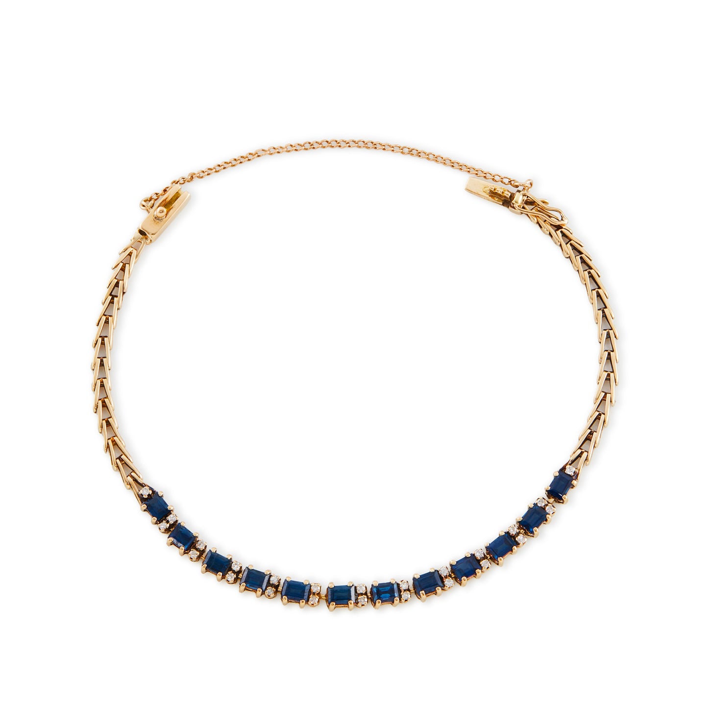 Classic 14ct gold tennis bracelet, set with twelve deep blue rectangular sapphires and twenty-four small diamonds.
