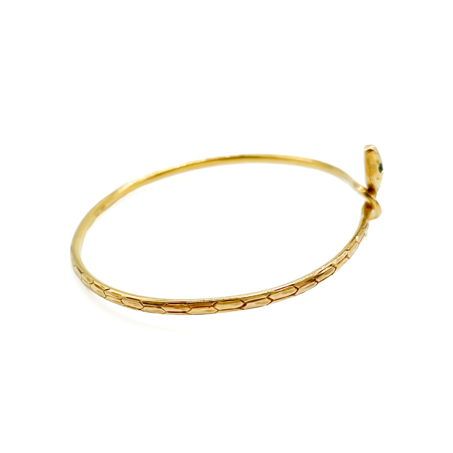 Charming 14ct gold serpent bangle with scale engraving and emerald eyes. Circa 1930's
