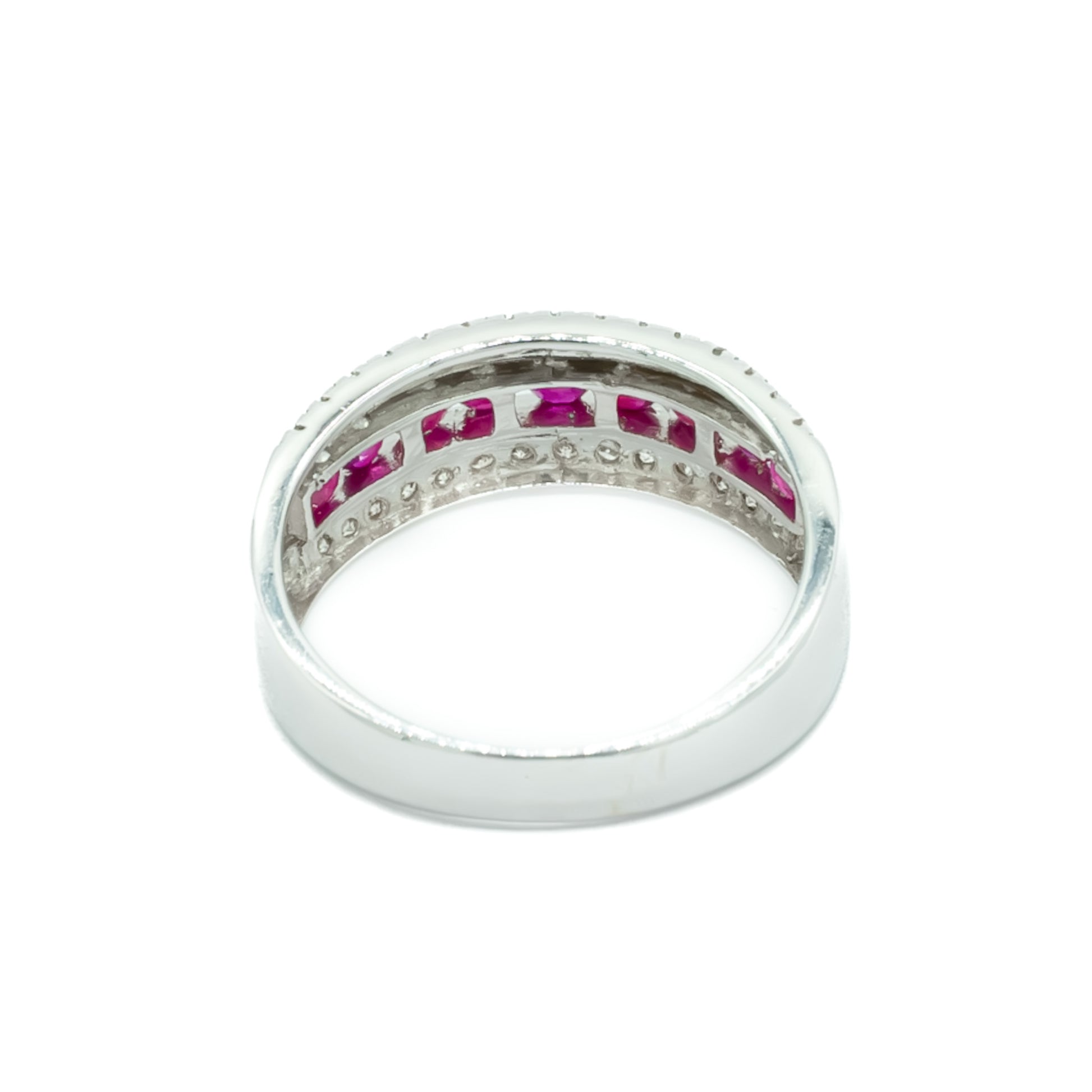 Classic vintage 14ct white gold ring set with nine faceted rubies and two rows of small diamonds. London