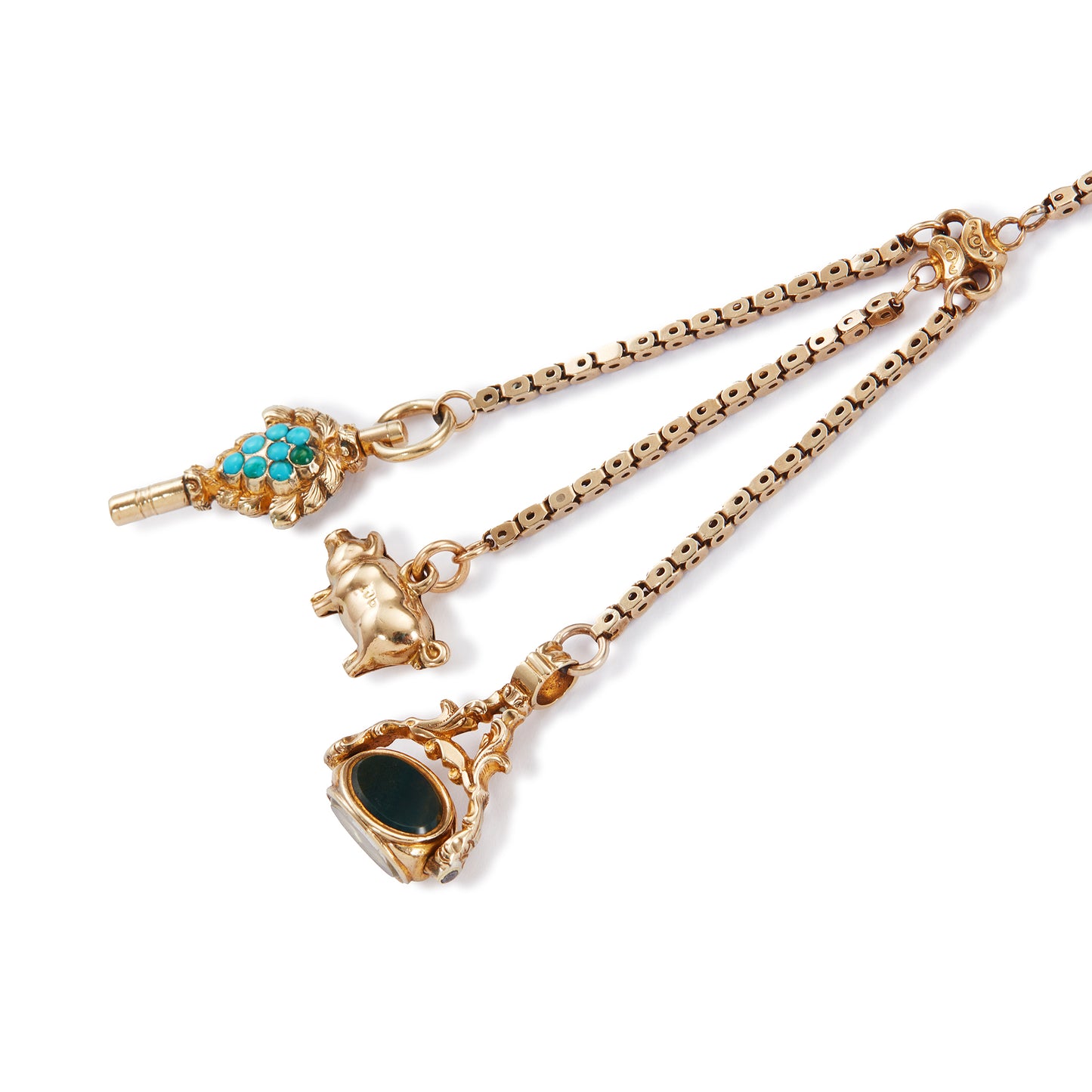 Highly sought after Victorian 15ct yellow gold attachment consisting of a dog clip, and three exquisite miniature pieces hanging from individual chains. The attachment consists of: a beautifully carved 15ct gold turquoise watch key, a 9ct gold pig charm and a 15ct gold swivel fob set with citrine, green agate and white chalcedony. Can be worn as a pendant or attached onto an Albertina.