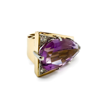 Very stylish 18ct gold ring set with a beautifully faceted pear-shaped amethyst and two small diamonds. Circa 1970's