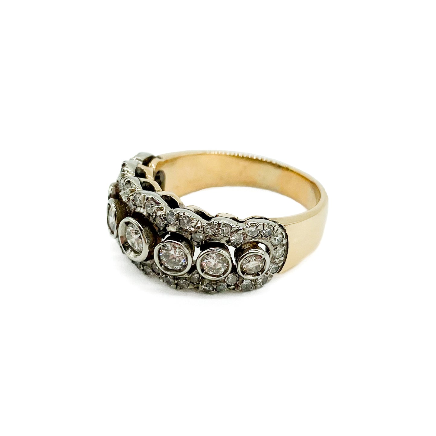 Magnificent 18ct yellow and white gold half eternity ring set with a middle row of seven diamonds, surrounded by forty-six tiny diamonds. Circa 1930’s