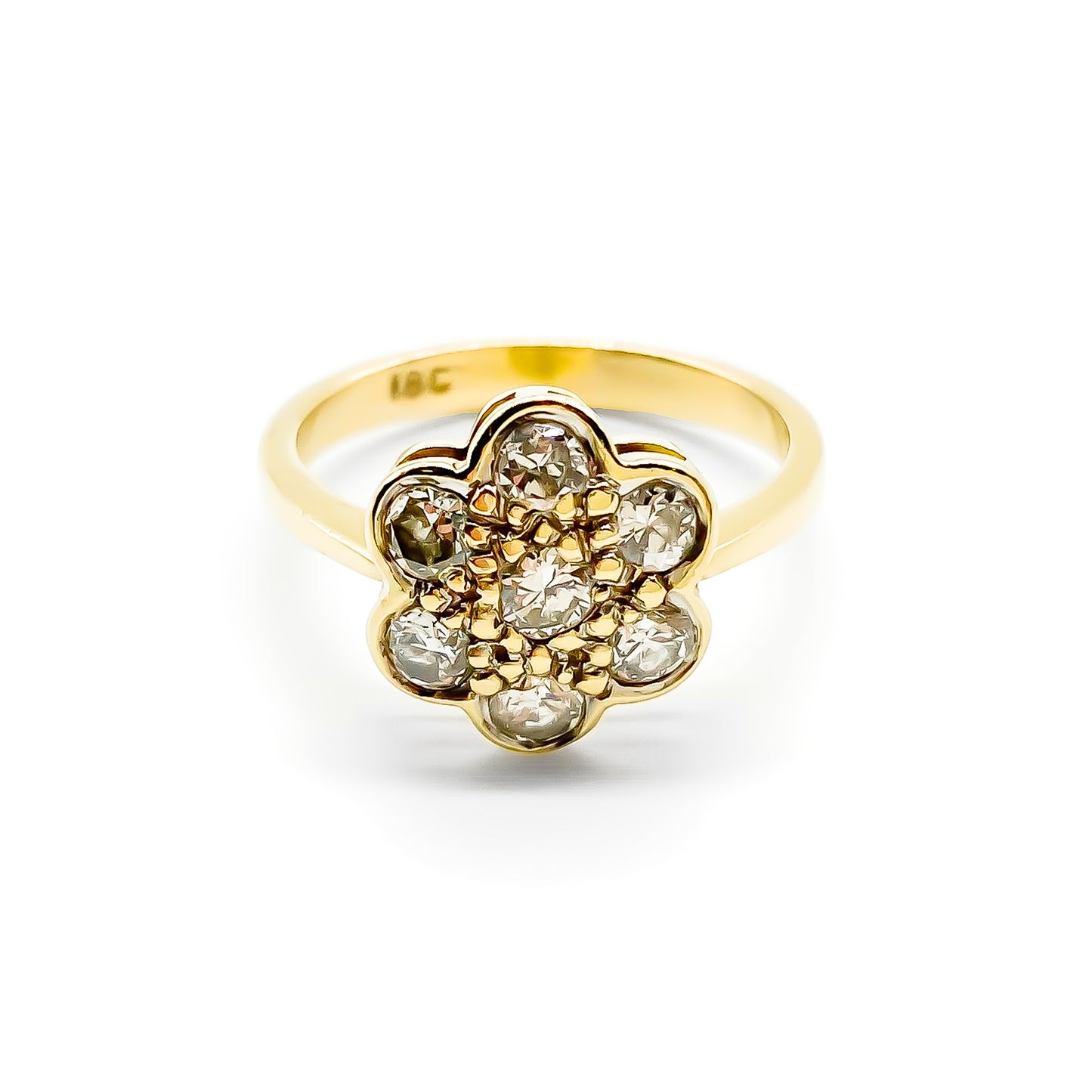 Lovely 18ct gold ring set with seven old-cut diamonds in the shape of a flower.