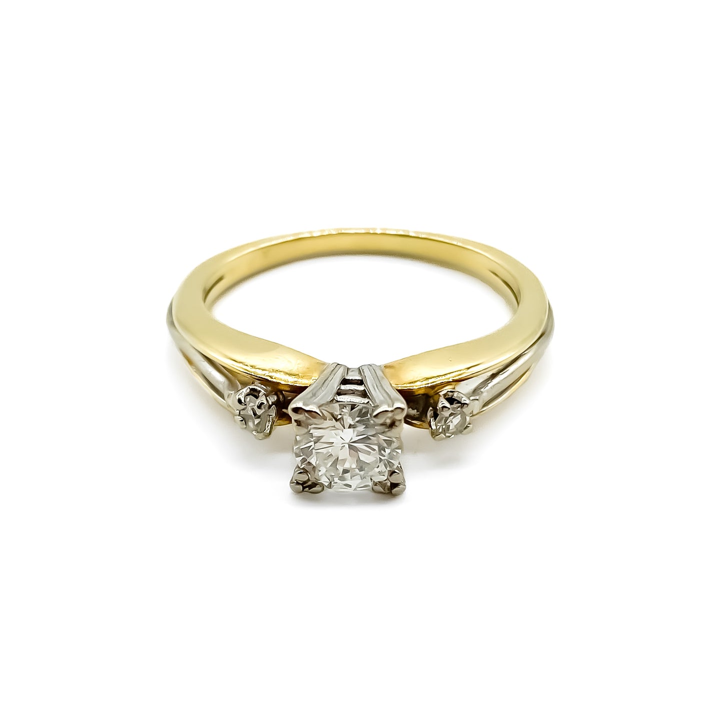 Classic 18ct yellow and white gold trilogy engagement ring set with three diamonds.   Circa 1950’s