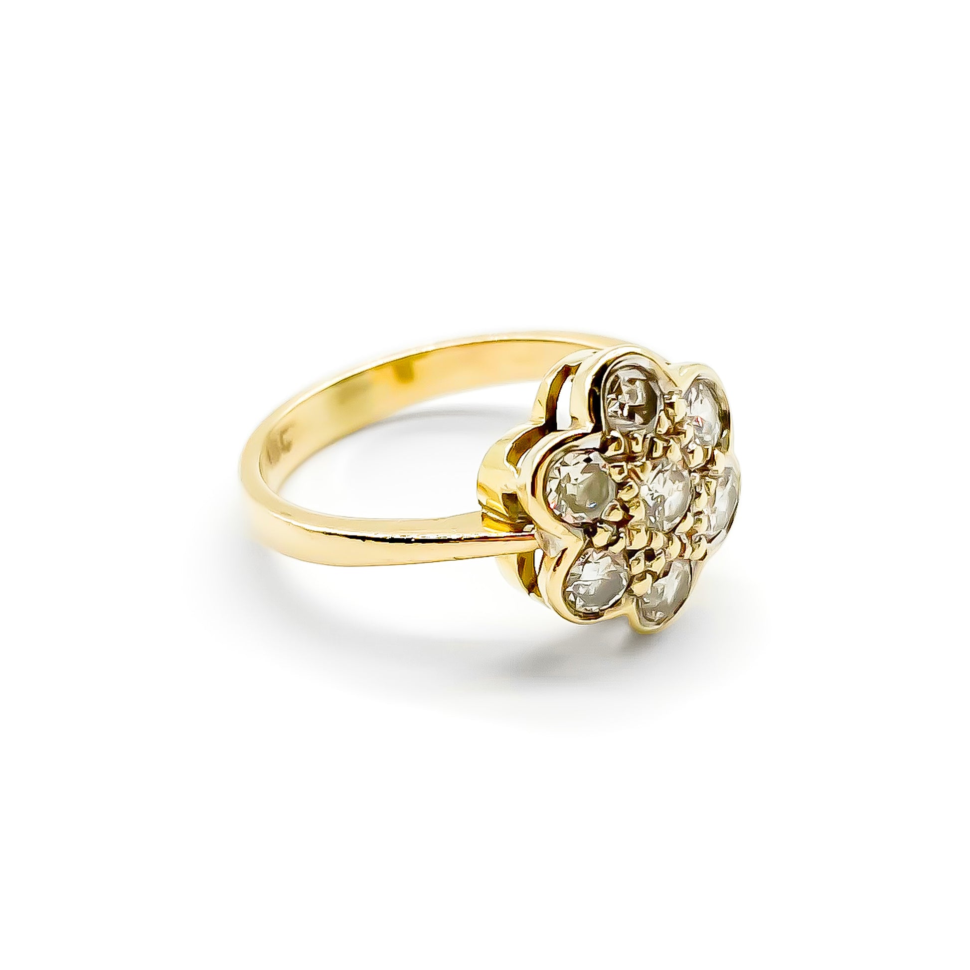 Lovely 18ct gold ring set with seven old-cut diamonds in the shape of a flower.