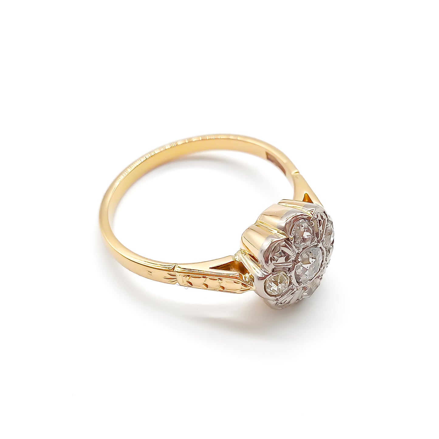 Dainty 18ct gold ring with five old-cut diamonds set in the shape of a flower.