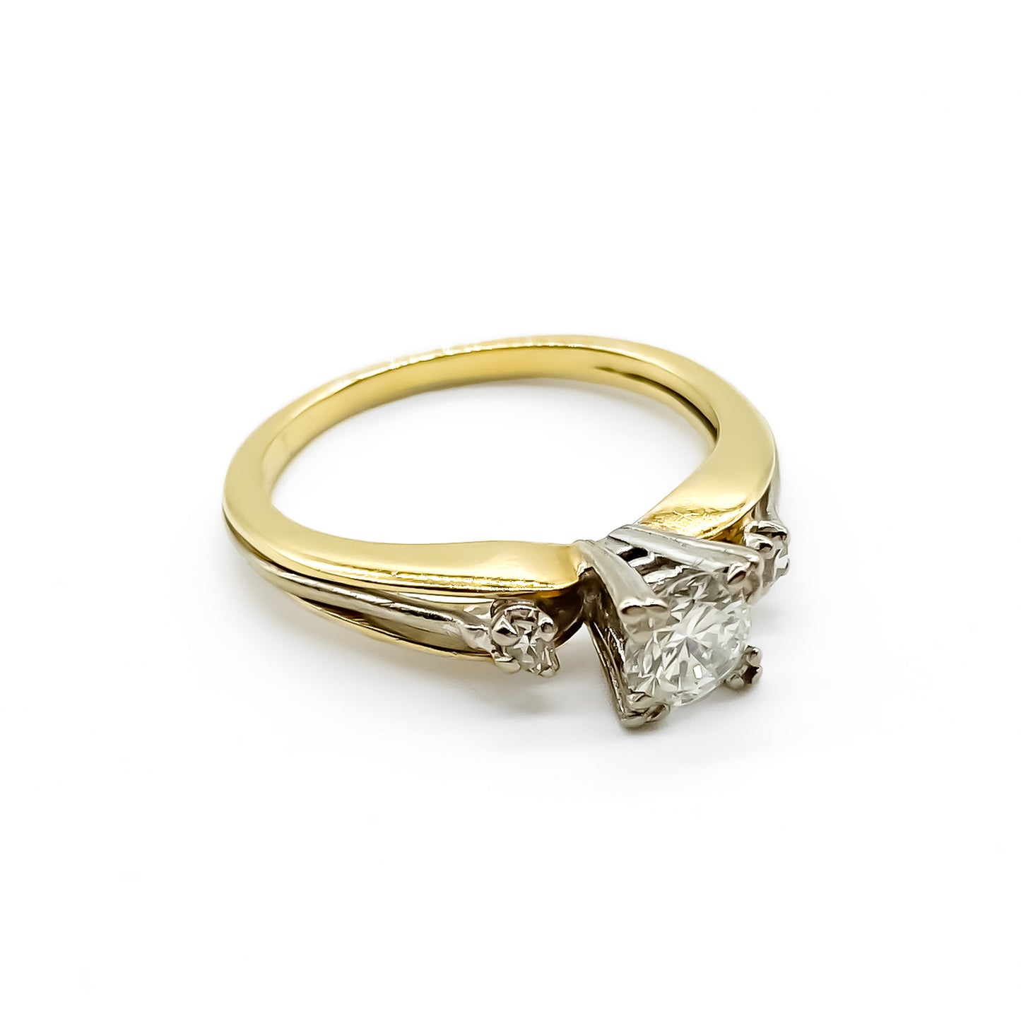 Classic 18ct yellow and white gold trilogy engagement ring set with three diamonds.   Circa 1950’s