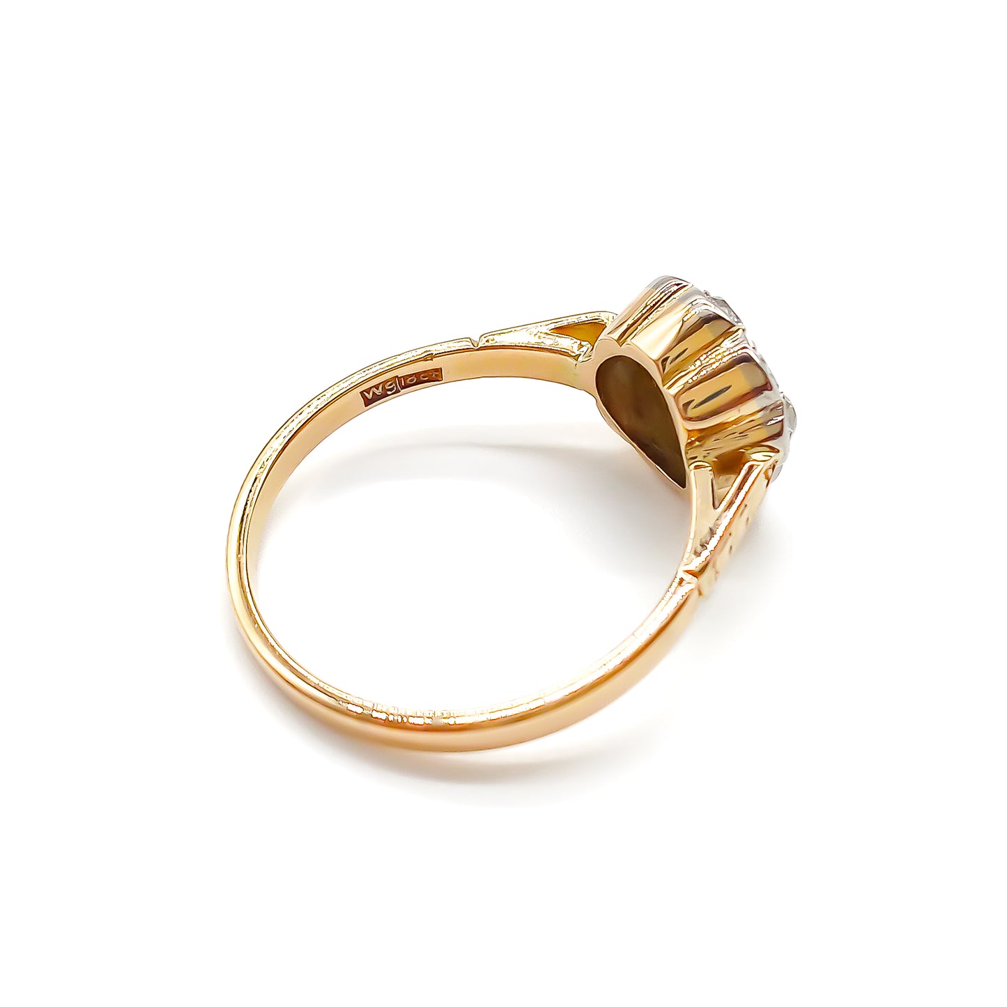 Dainty 18ct gold ring with five old-cut diamonds set in the shape of a flower.