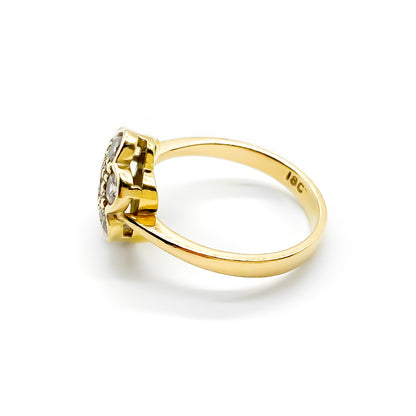 Lovely 18ct gold ring set with seven old-cut diamonds in the shape of a flower.