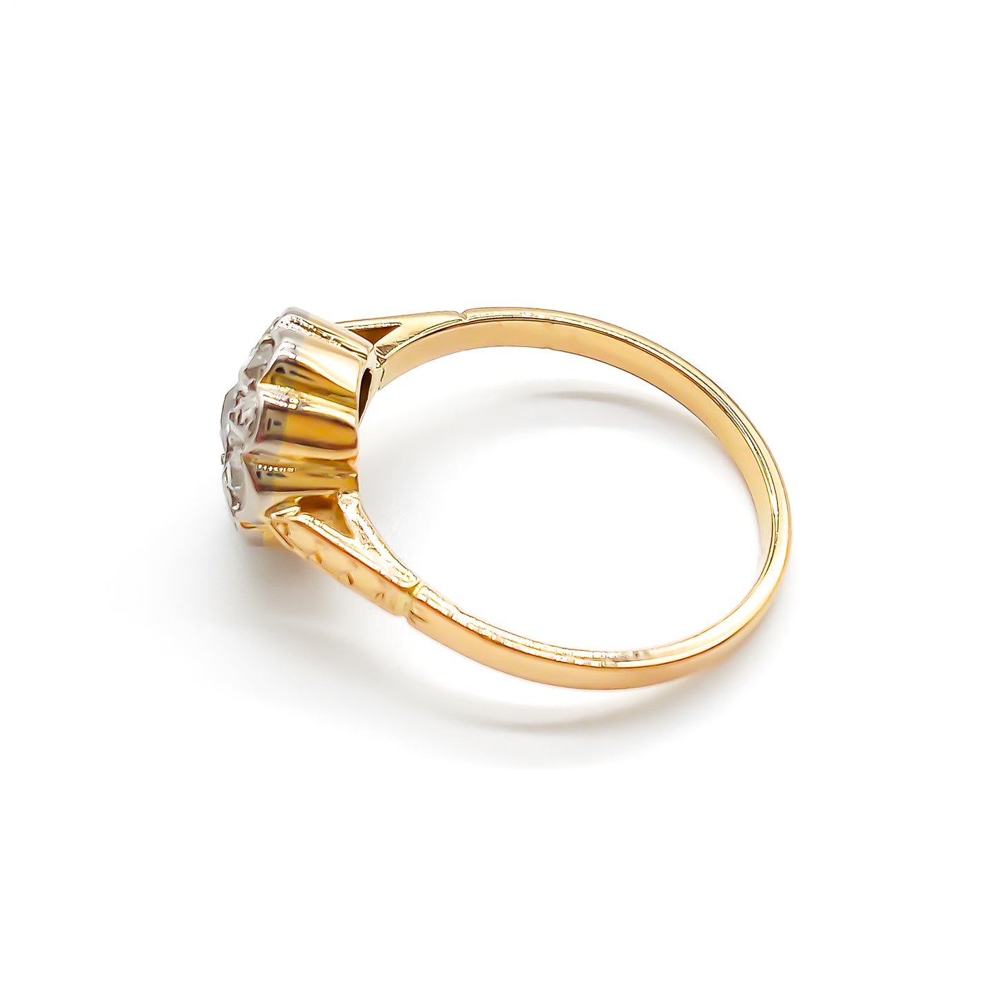 Dainty 18ct gold ring with five old-cut diamonds set in the shape of a flower.