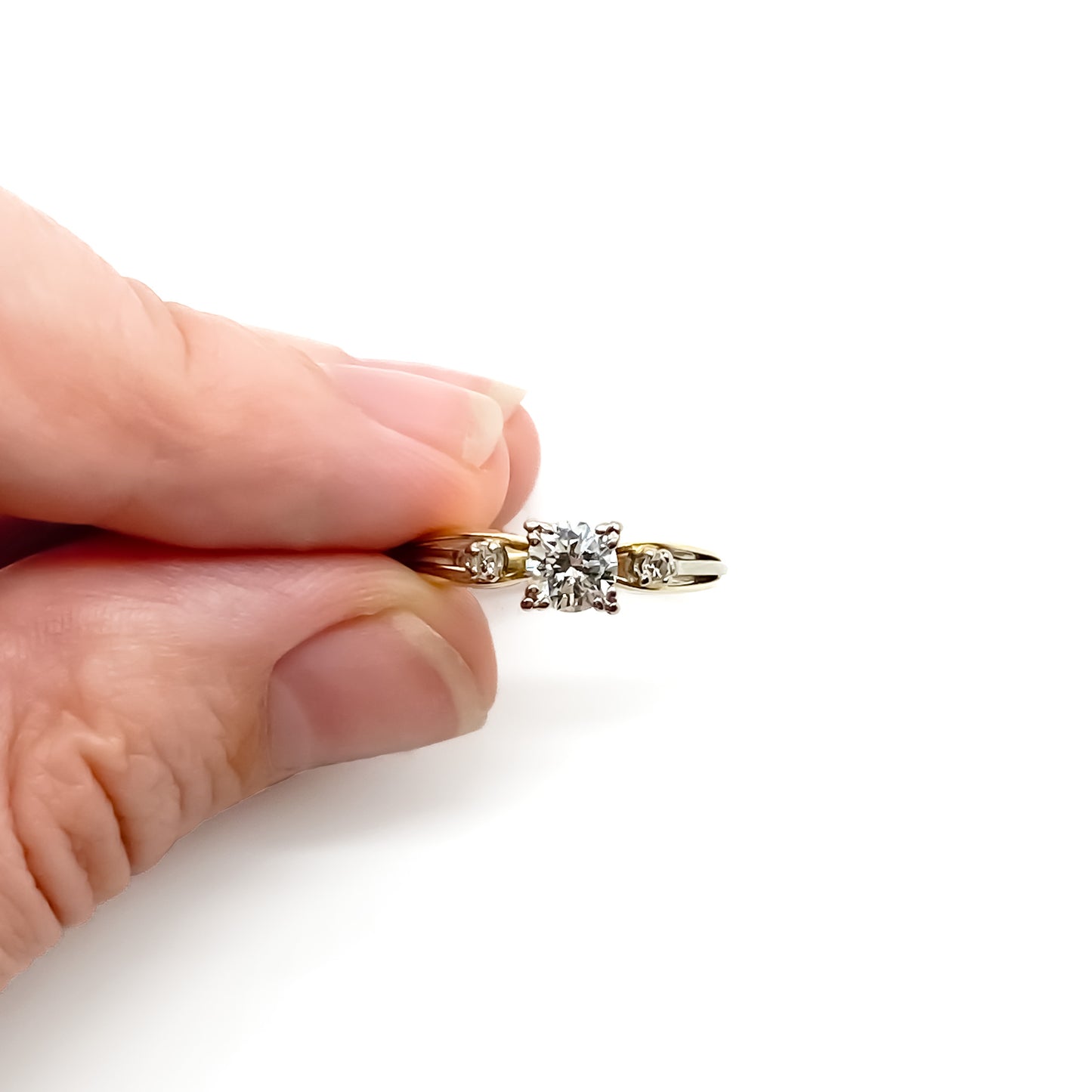 Classic 18ct yellow and white gold trilogy engagement ring set with three diamonds.   Circa 1950’s