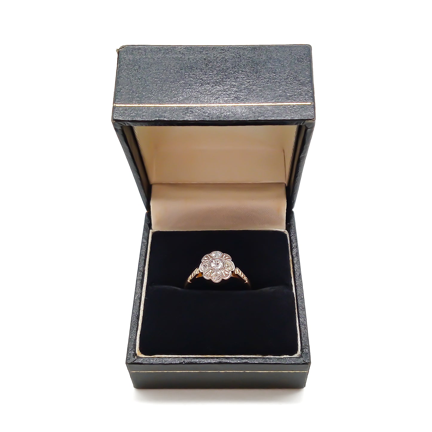 Dainty 18ct gold ring with five old-cut diamonds set in the shape of a flower.
