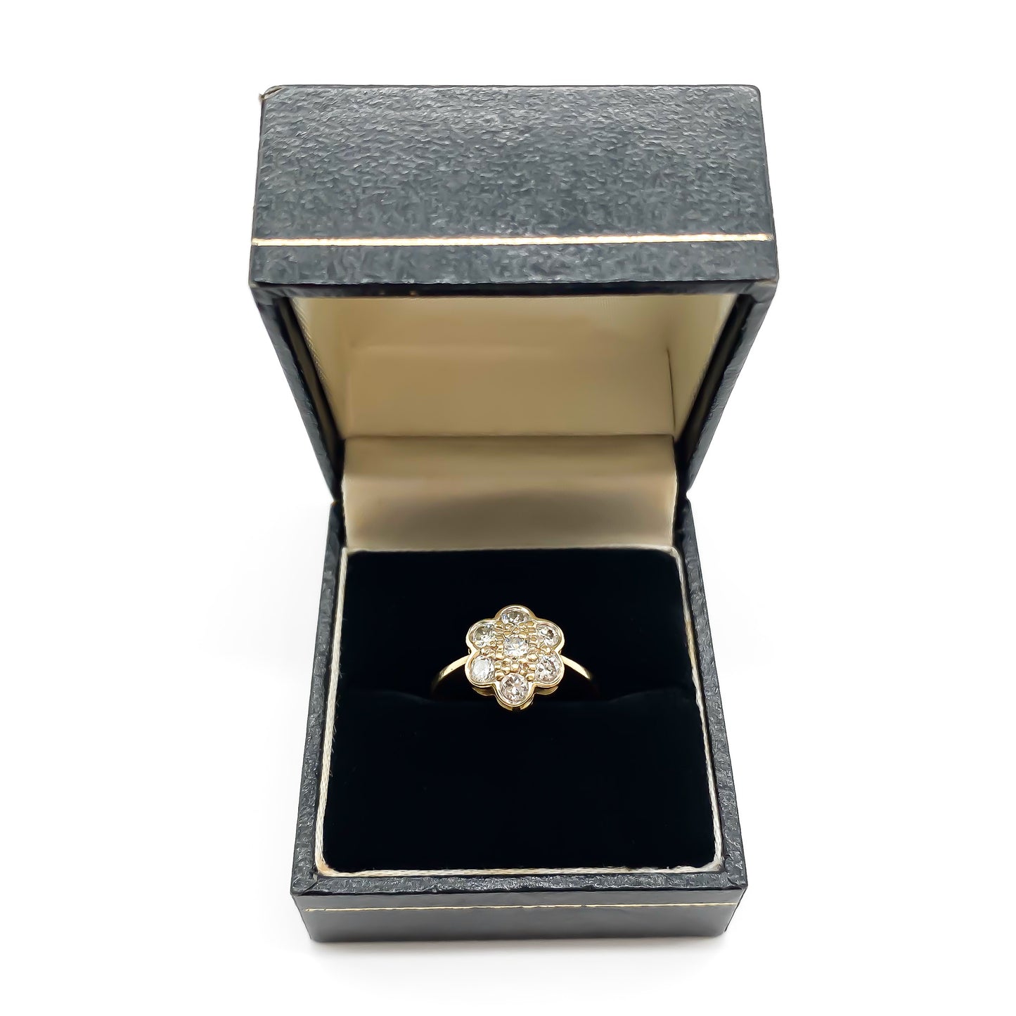 Lovely 18ct gold ring set with seven old-cut diamonds in the shape of a flower.