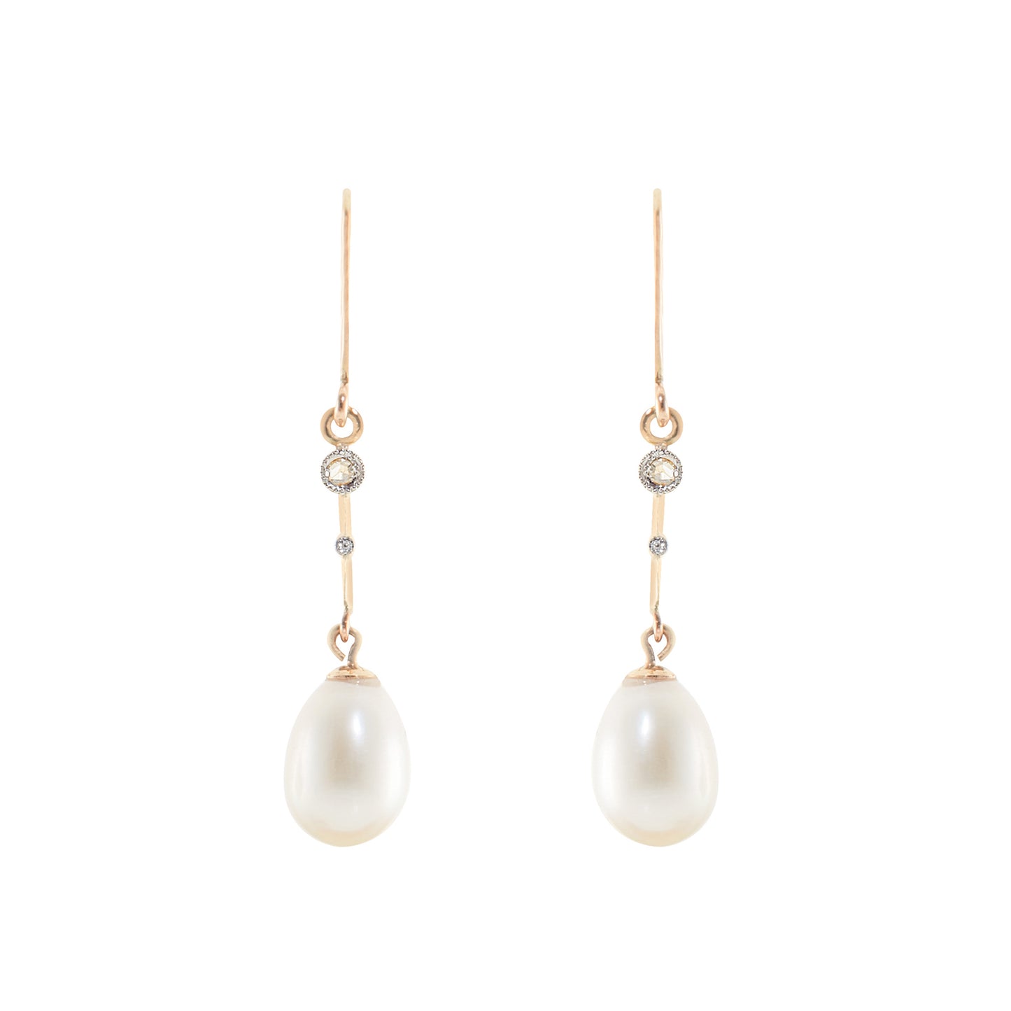 Delicate vintage 18ct gold dangling earrings, each set with a mine cut diamond and a lustrous pearl drop.