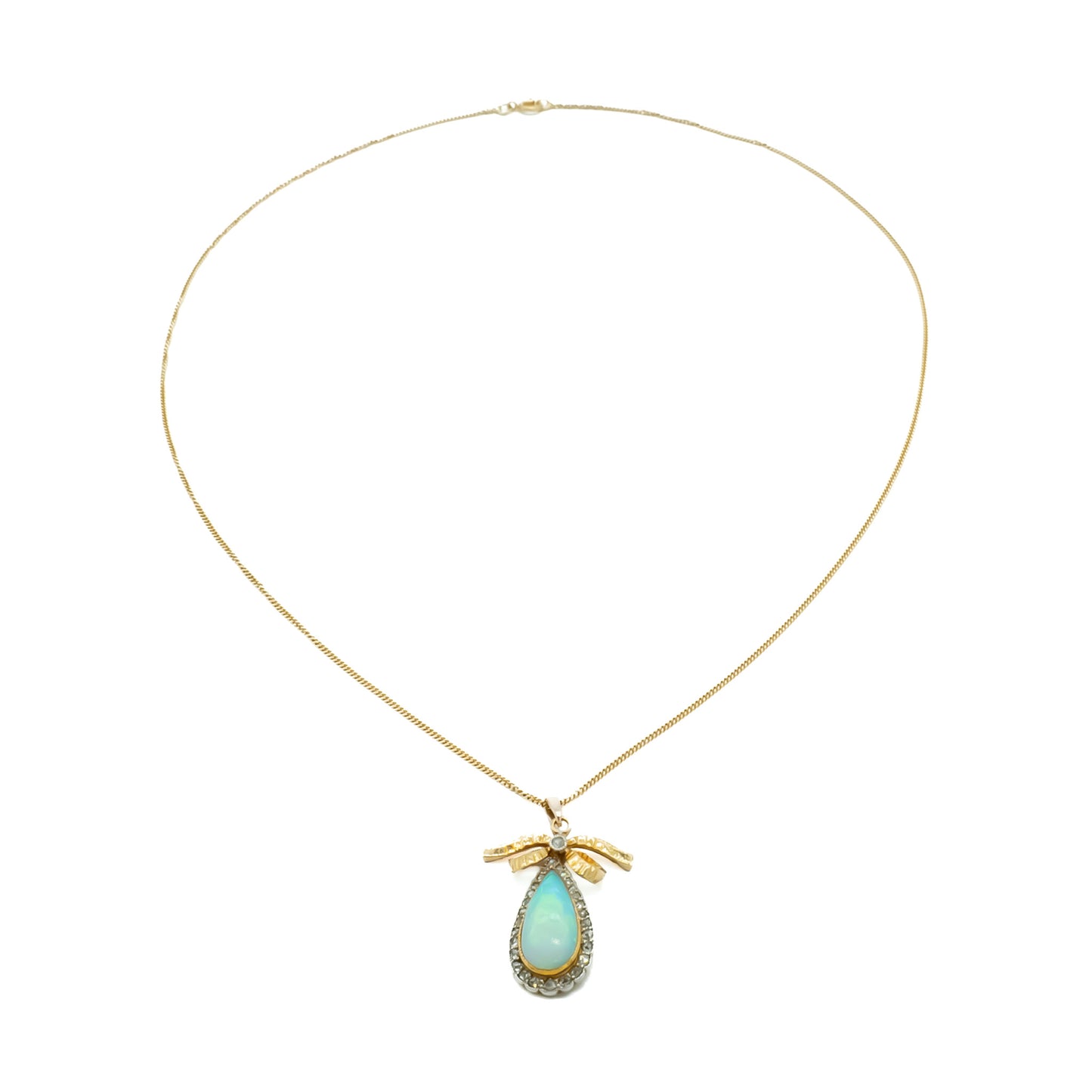 Exquisite 18ct yellow gold pendant set with a luminous opal surrounded by old-cut diamonds on an 18ct gold chain.