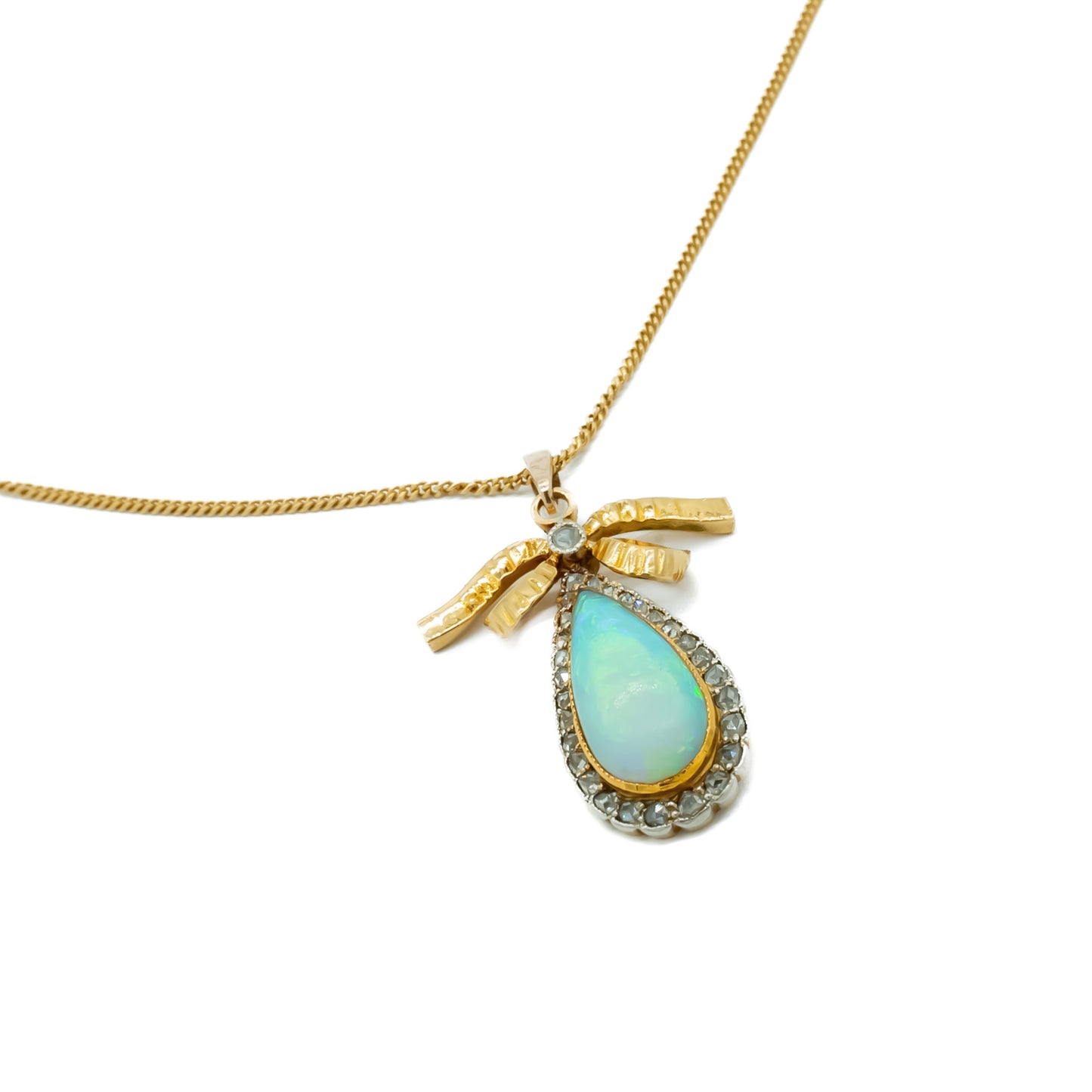 Exquisite 18ct yellow gold pendant set with a luminous opal surrounded by old-cut diamonds on an 18ct gold chain.