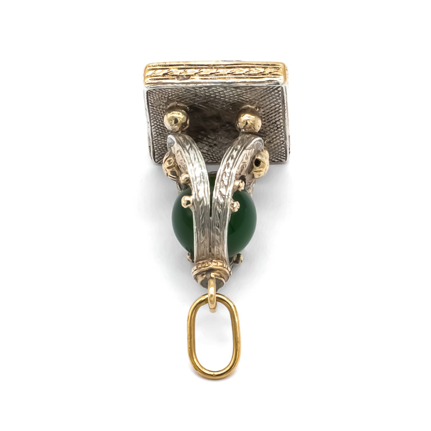 Very ornate 18ct gold and silver Victorian fob pendant set with a carnelian disc and a jade bead. Lovely engraving. Italy