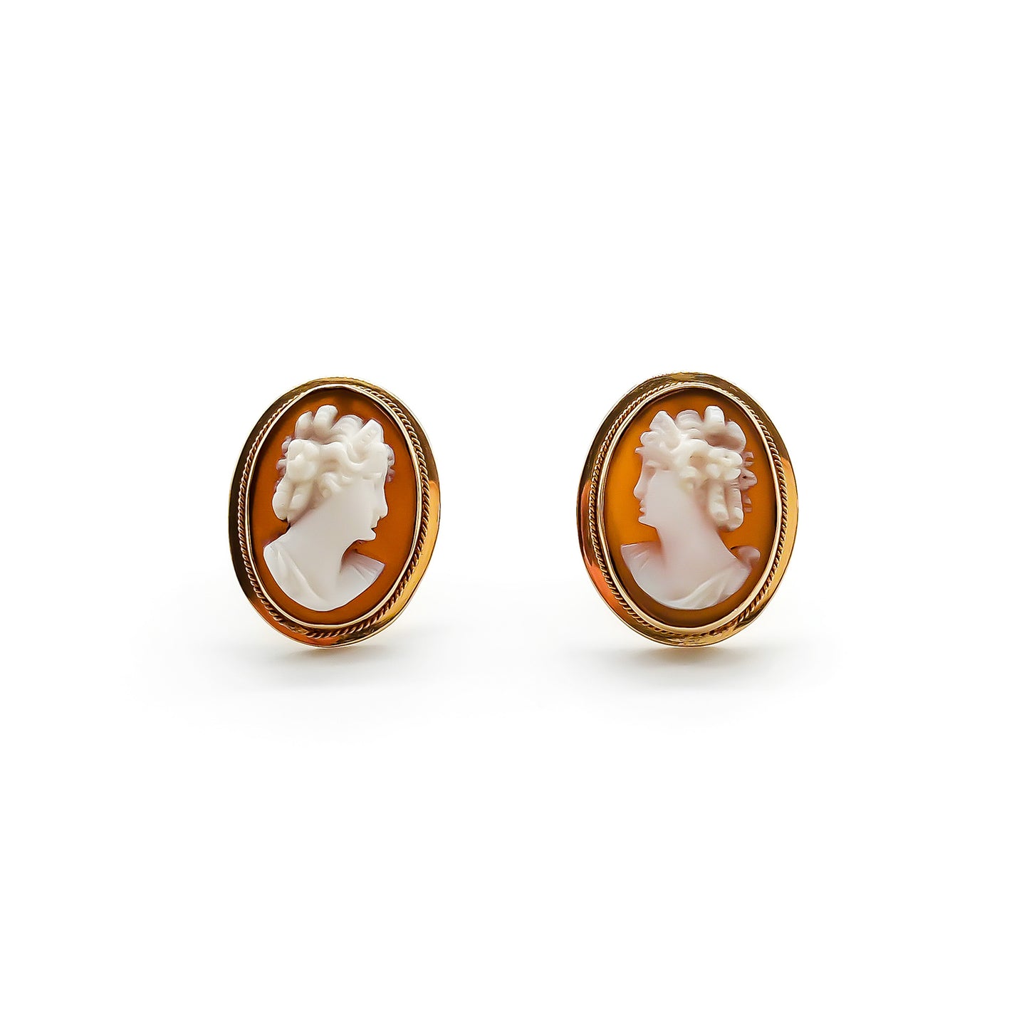 Classic 18ct rose gold stud earrings set with beautifully carved cameos.