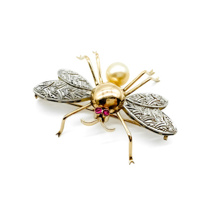 Exquisite 18ct rose gold insect brooch with diamond encrusted wings, ruby eyes and a pearl. 