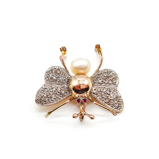 Exquisite 18ct rose gold insect pendant with white gold diamond encrusted wings, ruby eyes and a pearl body. Circa 1940’s