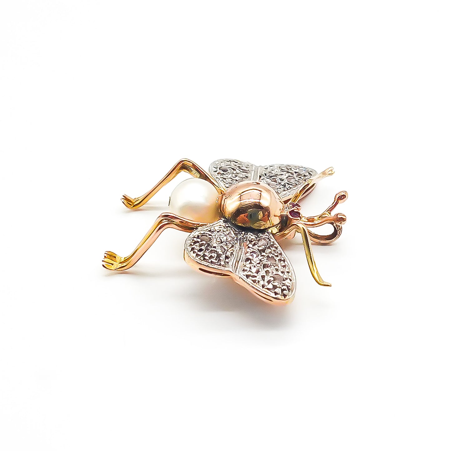 Exquisite 18ct rose gold insect pendant with white gold diamond encrusted wings, ruby eyes and a pearl body. Circa 1940’s