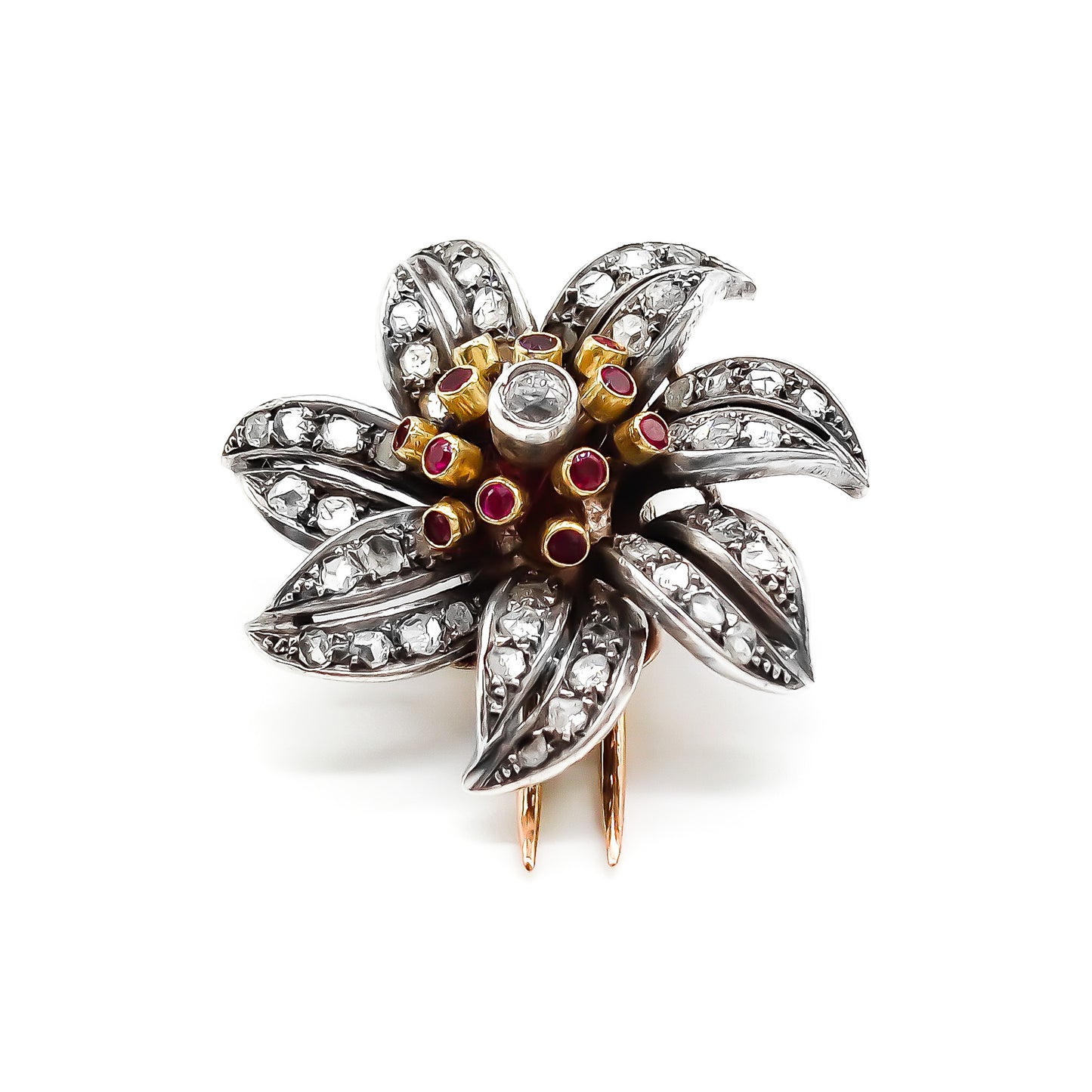 Magnificent 18ct rose gold and silver flower clip brooch with old cut, pavé set diamonds, rubies and a centre old cut diamond in a tube setting. Circa 1900