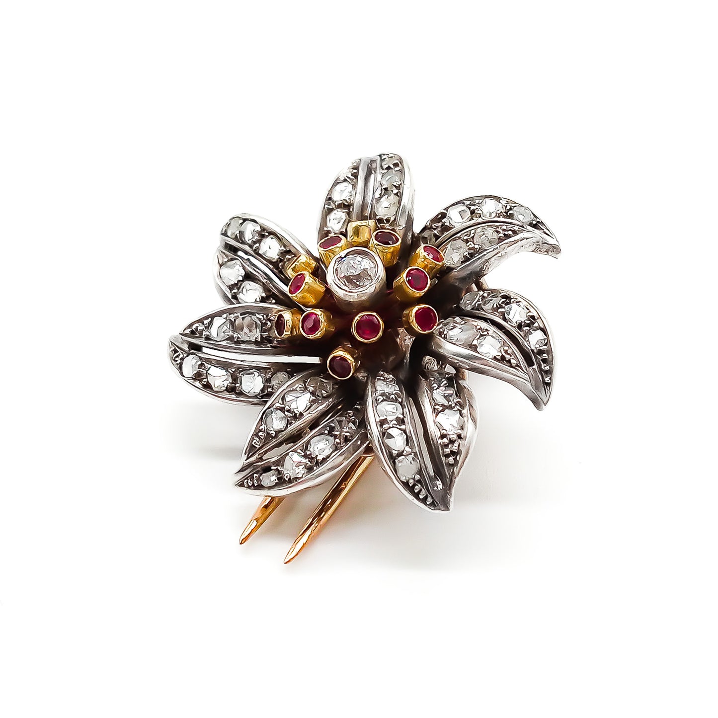 Magnificent 18ct rose gold and silver flower clip brooch with old cut, pavé set diamonds, rubies and a centre old cut diamond in a tube setting. Circa 1900