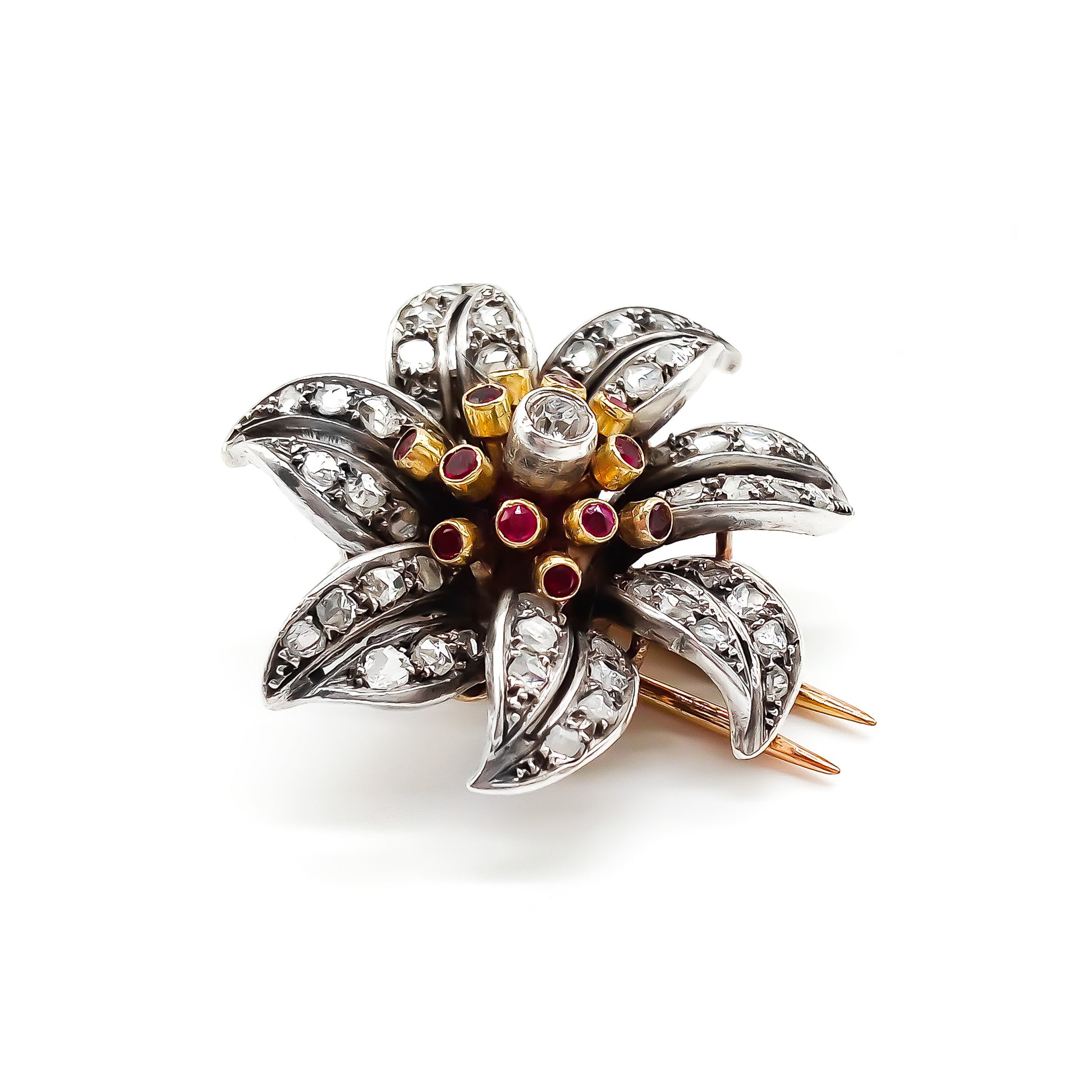 Magnificent 18ct rose gold and silver flower clip brooch with old cut, pavé set diamonds, rubies and a centre old cut diamond in a tube setting. Circa 1900