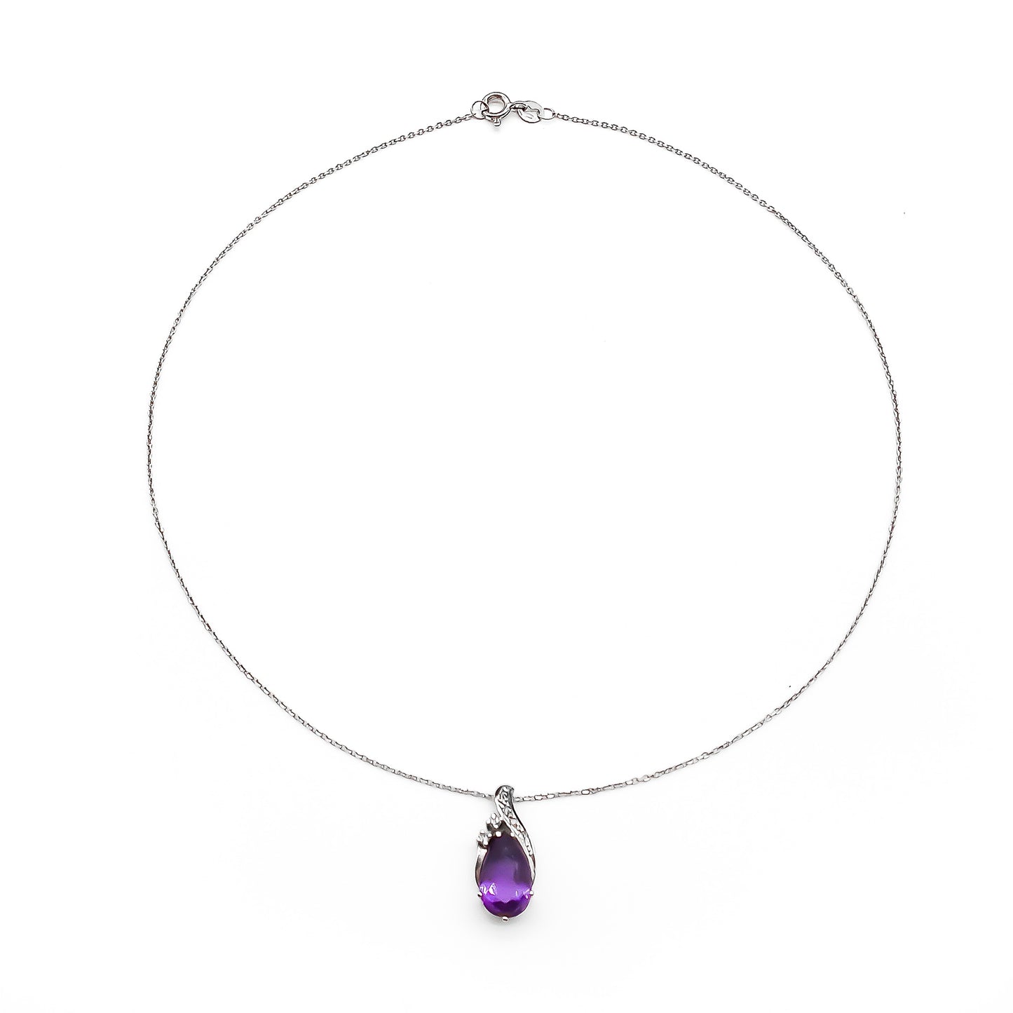 Dainty 18ct white gold diamond pendant set with a deep purple pear-cut amethyst on an 18ct white gold chain.