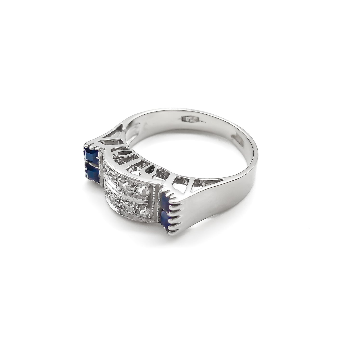 Stylish 18ct white gold ring set with four rectangular sapphires and eight round diamonds.