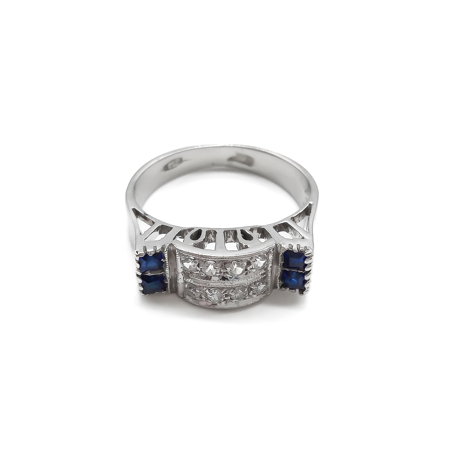 Stylish 18ct white gold ring set with four rectangular sapphires and eight round diamonds.