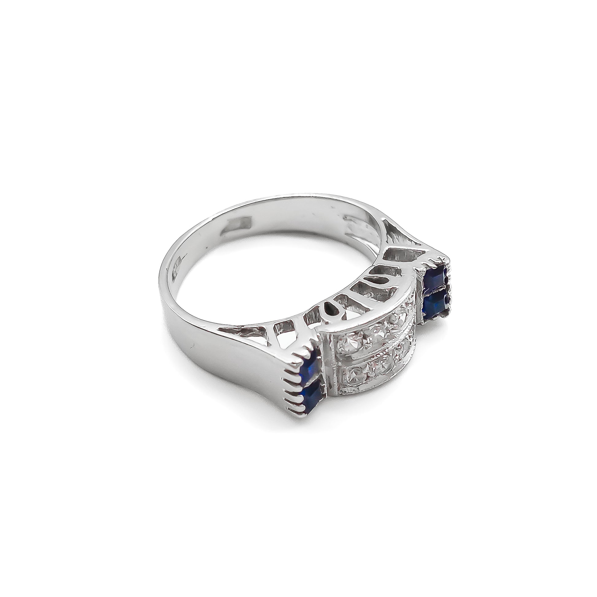 Stylish 18ct white gold ring set with four rectangular sapphires and eight round diamonds.