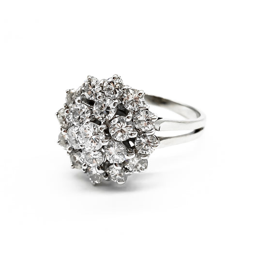 Glamorous 18ct white gold ring with nineteen sparkling diamonds in a cluster tier setting. Size: P
