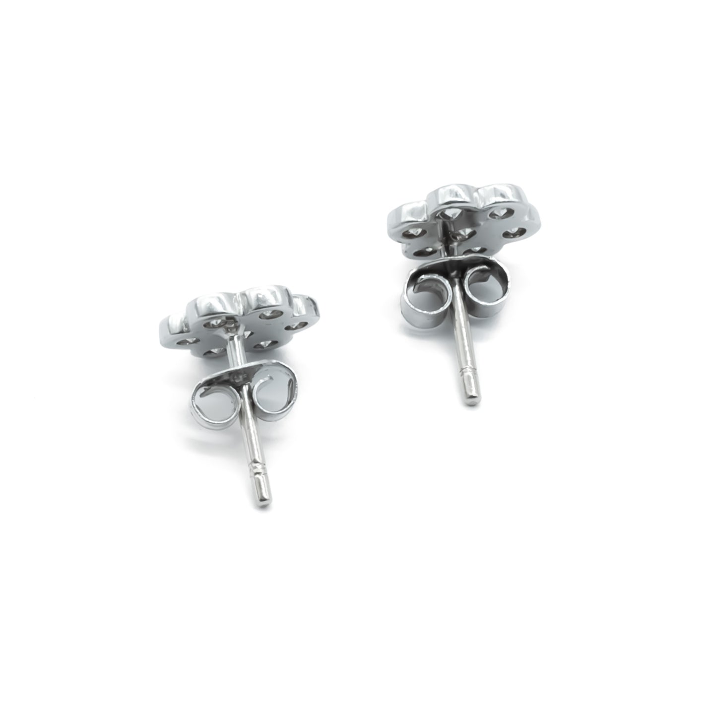 Classic 18ct white gold flower shaped stud earrings, each set with seven diamonds.