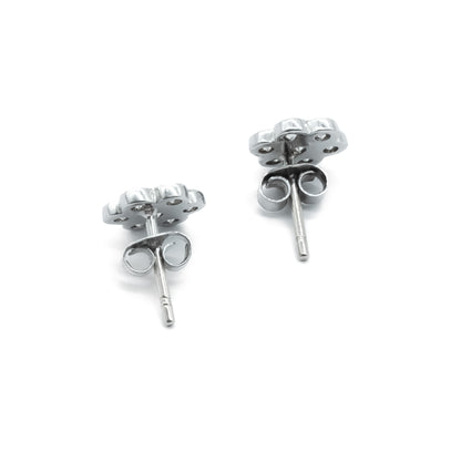 Classic 18ct white gold flower shaped stud earrings, each set with seven diamonds.