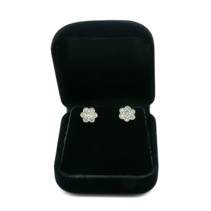 Classic 18ct white gold flower shaped stud earrings, each set with seven diamonds.