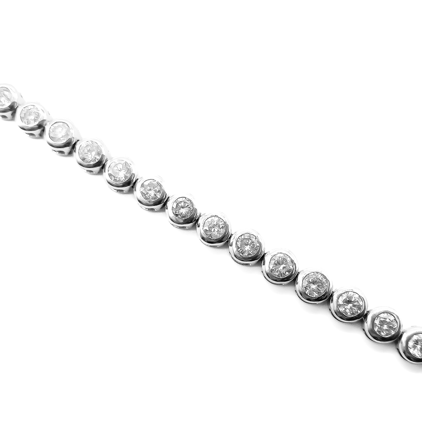 Exquisite tennis bracelet with forty sparkling diamonds, each set in an 18ct white gold tube setting. Bracelet has a safety clasp.