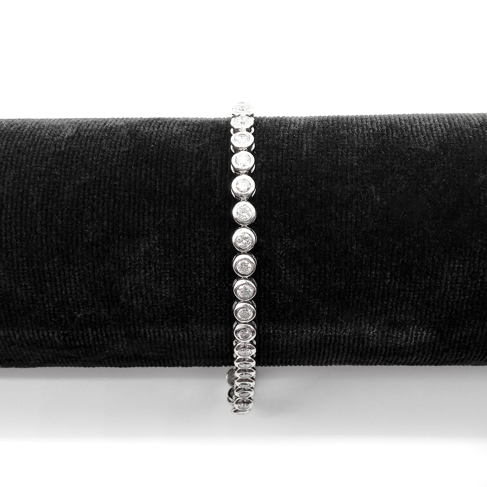 Exquisite tennis bracelet with forty sparkling diamonds, each set in an 18ct white gold tube setting. Bracelet has a safety clasp.