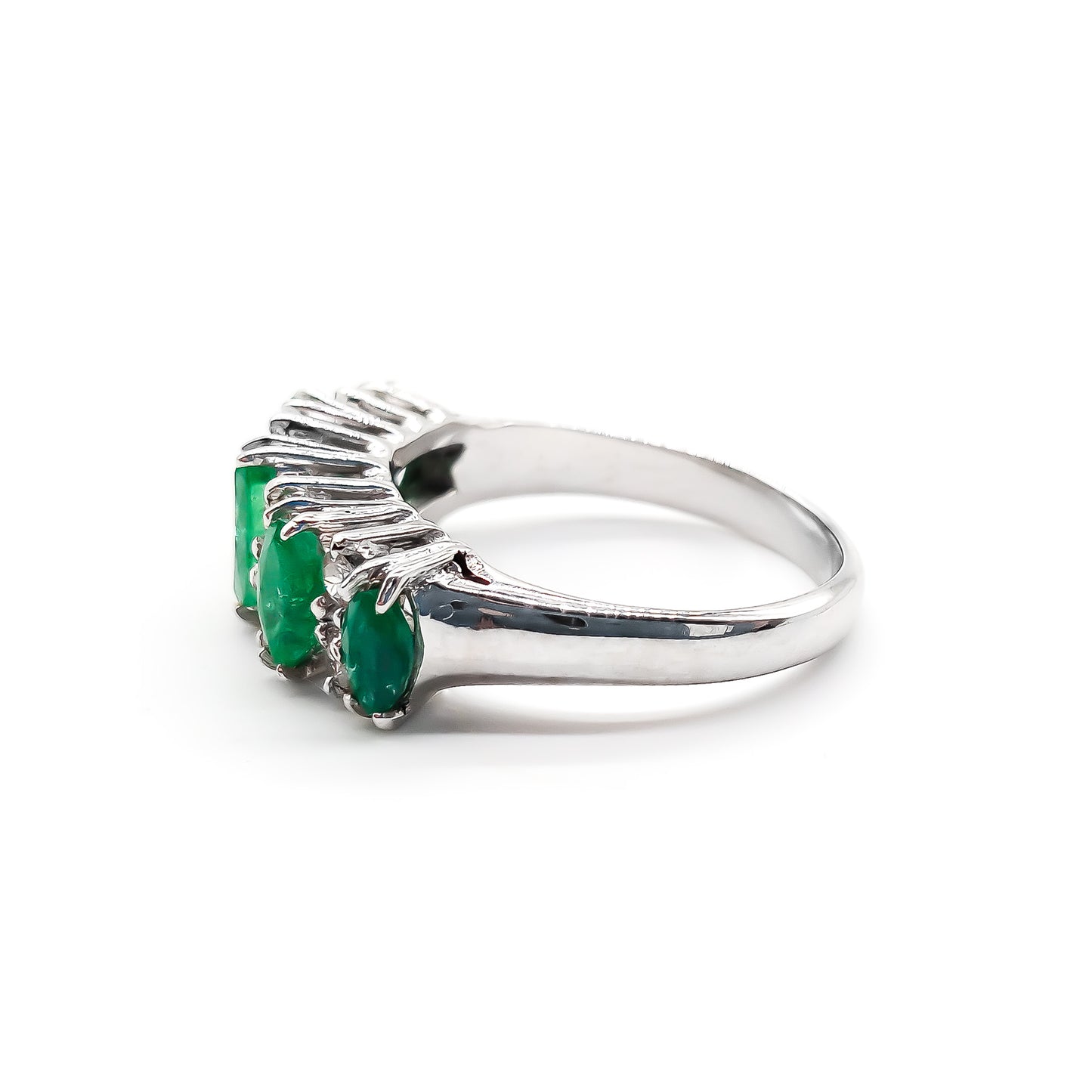 Stunning vintage 18ct white gold ring set with five marquise-cut emeralds and eight round diamonds.