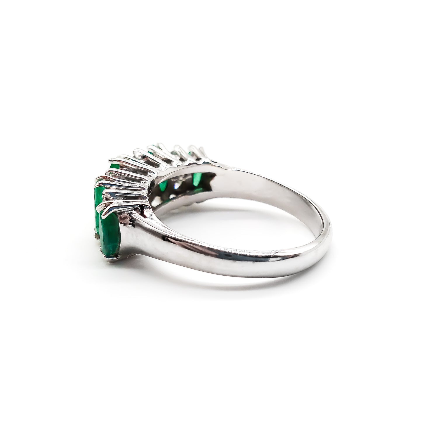 Stunning vintage 18ct white gold ring set with five marquise-cut emeralds and eight round diamonds.