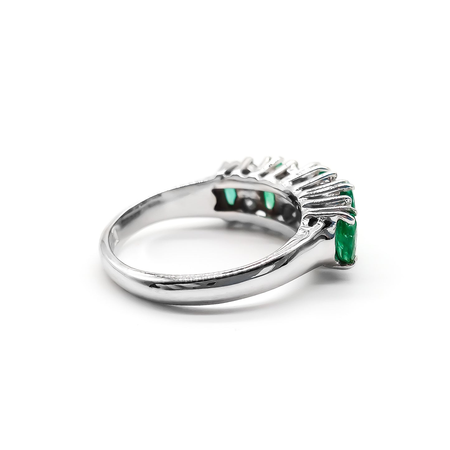 Stunning vintage 18ct white gold ring set with five marquise-cut emeralds and eight round diamonds.