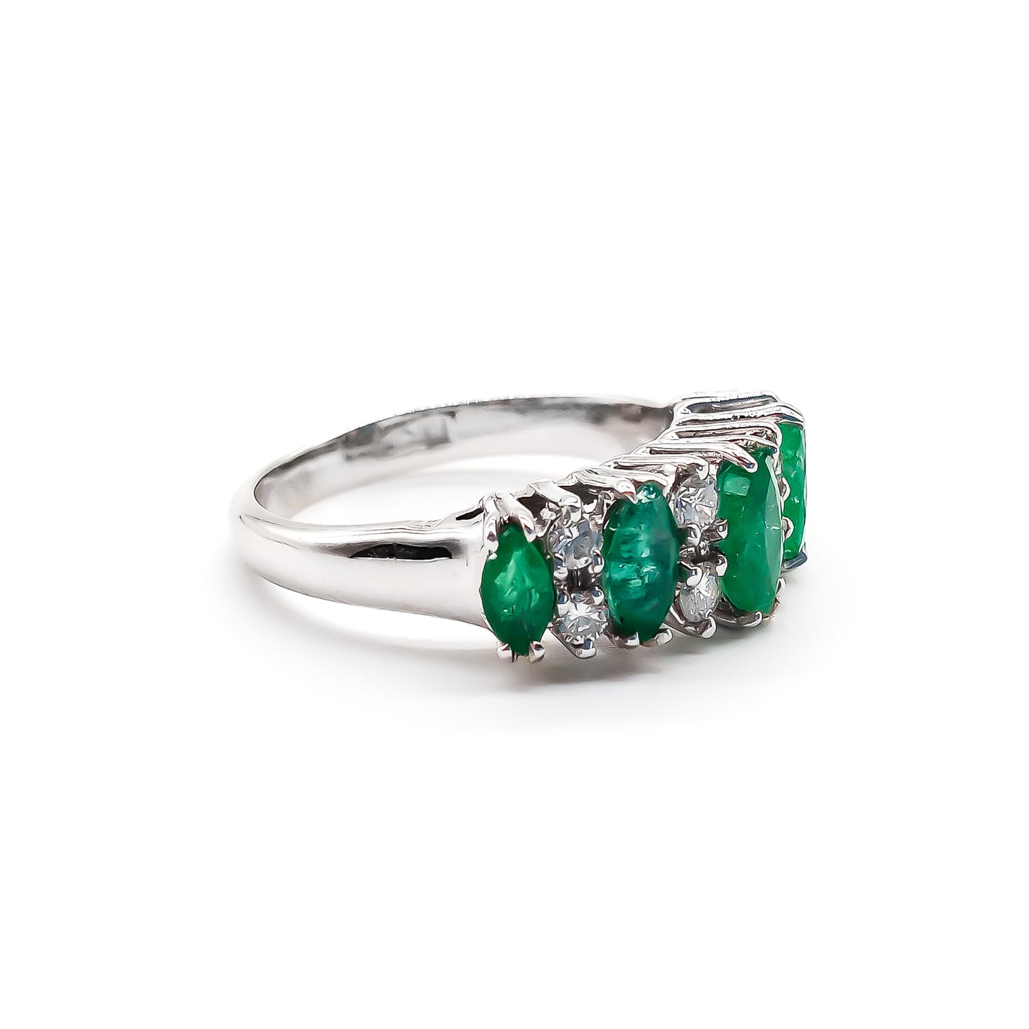 Stunning vintage 18ct white gold ring set with five marquise-cut emeralds and eight round diamonds.