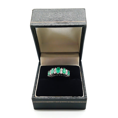 Stunning vintage 18ct white gold ring set with five marquise-cut emeralds and eight round diamonds.